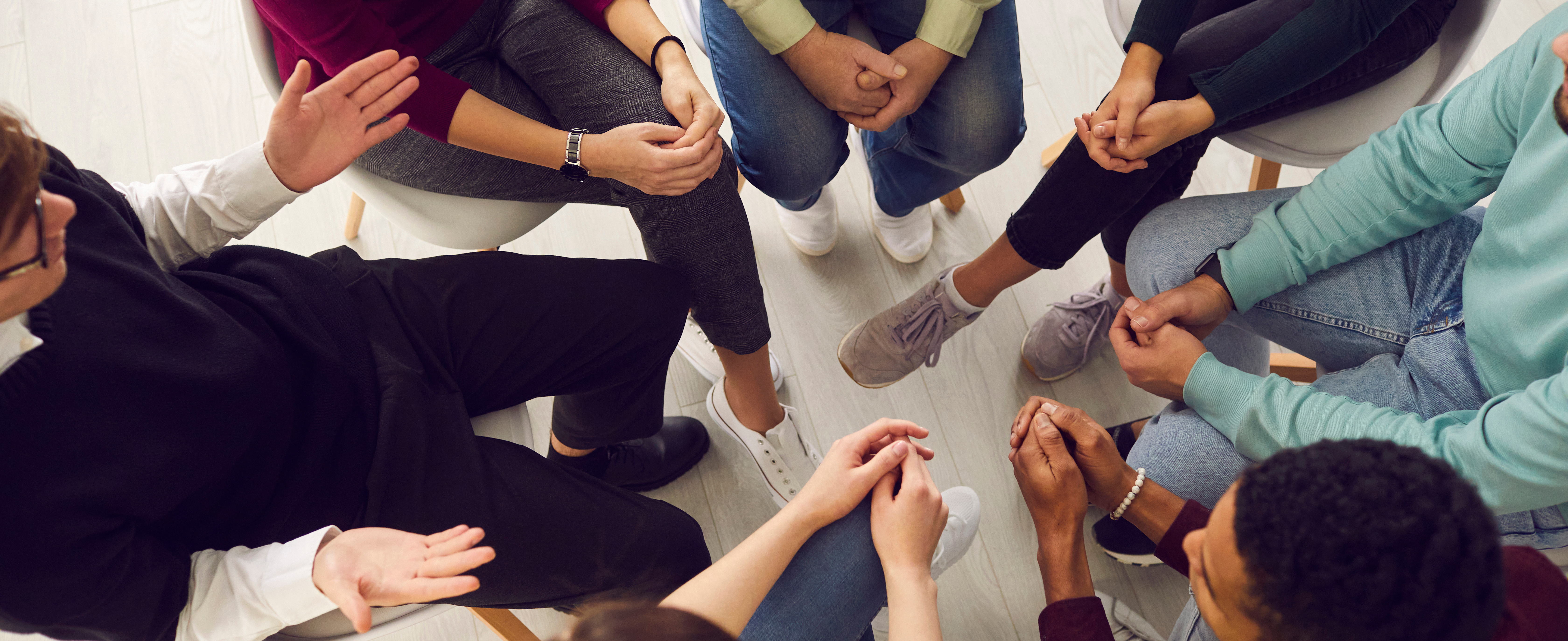 Cancer support group participants sitting in a circle during a guided networking and wellness discussion at the Cancer Support Center